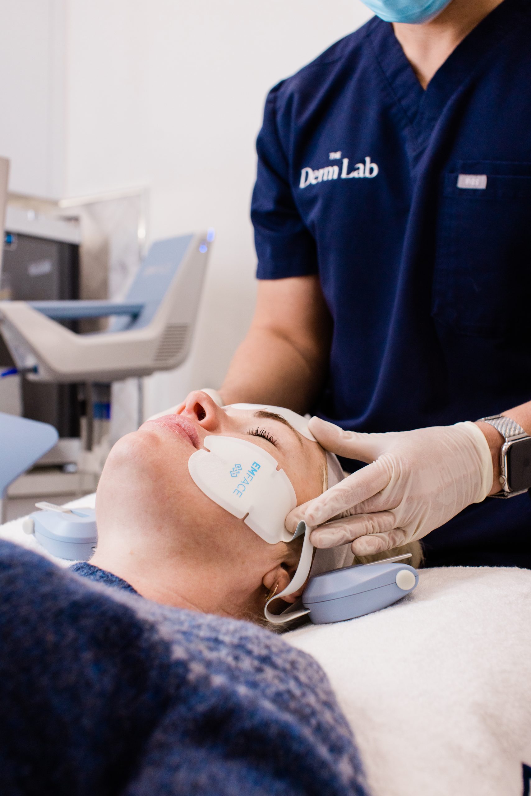 Clinician performing Emface facial muscle lifting treatment on a client in Melbourne